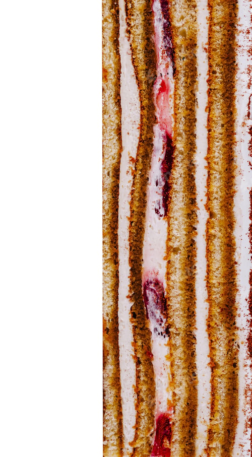 Preview: Delicious layered cake with cream filling and red jam on white background