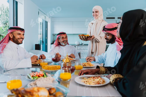 Preview: Arab family enjoying traditional meal together during ramadan