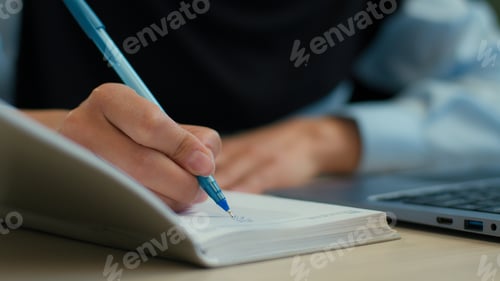 Preview: Cropped shot female hands student study use laptop write in notebook exam online education unknown