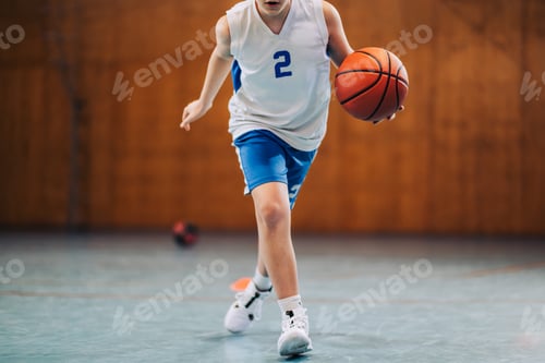Preview: Kid in motion playing basketball