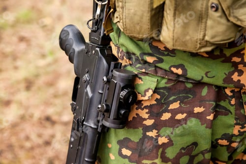 Preview: Close up weapon russian soldier man dressed military camouflage uniform with rifle in woodland