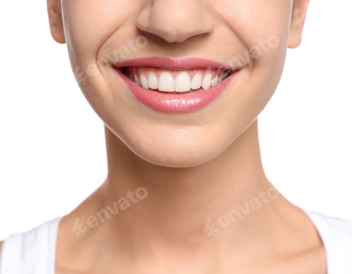 Preview: Young woman with beautiful smile on white background, closeup. Teeth whitening
