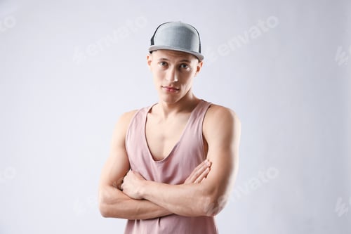 Preview: Young man in stylish baseball hat on light grey background