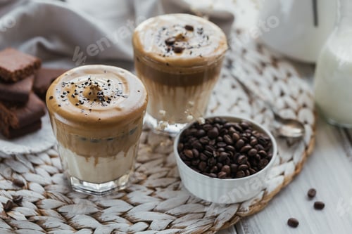 Preview: Glass of Iced Dalgona Coffee, trendy fluffy creamy whipped coffee and milk