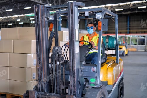Preview: Forklift truck working in the big warehouse