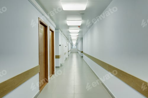 Preview: Brightly lit corridor in a sports hall with doors leading off it.