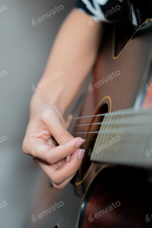 Preview: Young women playing acoustic guitar
