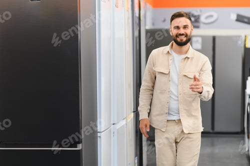 Preview: Customer choosing new refrigerator in electronics store