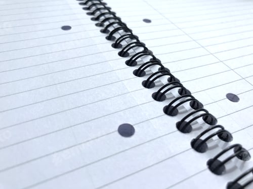 Preview: Spiral bound notebook with punched and lined paper, open and unused