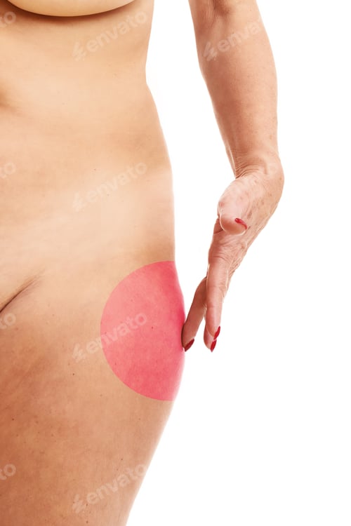 Preview: Senior woman touching abdomen over white background