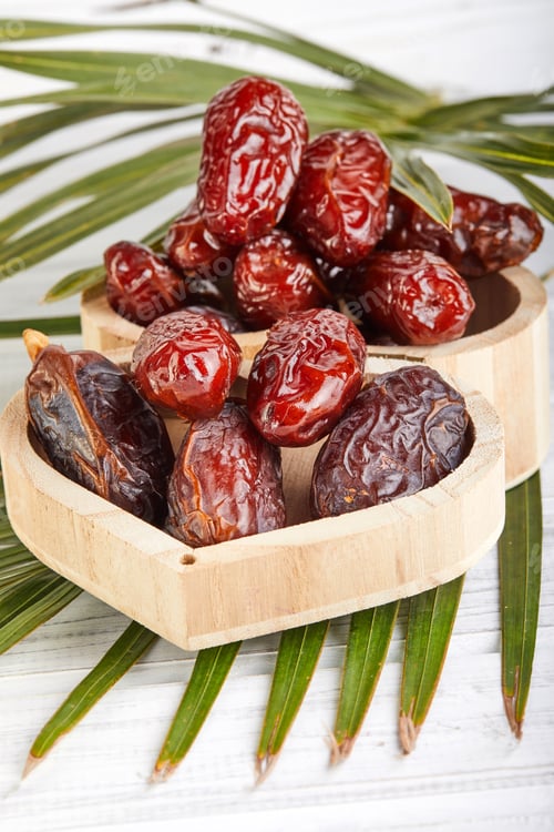 Preview: Date fruits with palm leaves, Raw Organic Dates Ready to Eat. Ramadan food concept