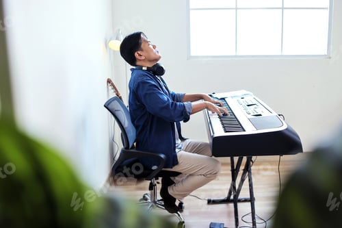 Preview: Full Length Of Talented Male Pianist With Her Masterful Performance on a Electric Piano