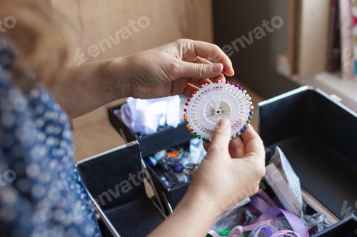 Preview: Handicraft Enthusiast Organizing Sewing Pins and Supplies