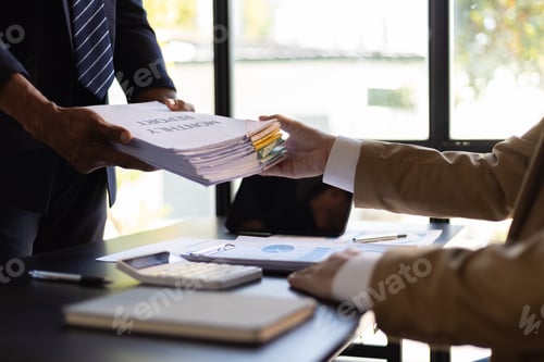 Preview: Businessman is stressed with paperwork in the office.