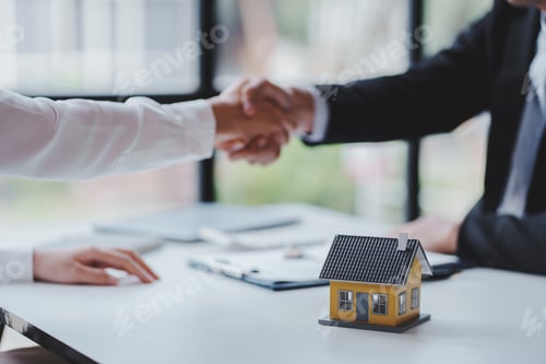 Preview: Handshake real estate agents deliver sample homes to customers. mortgage loan agreement Make a contr