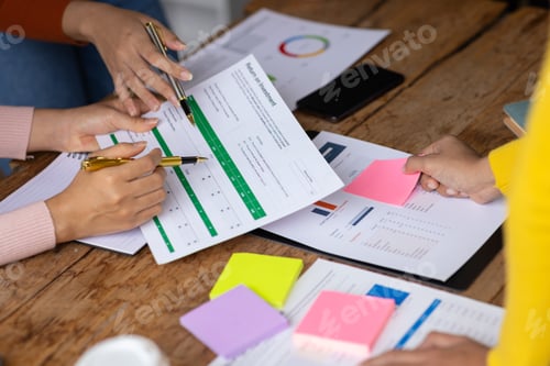 Preview: Businesswoman meeting with colleagues to discuss strategy analysis and start-up business planning.