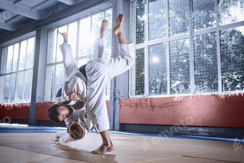 Preview: Two judo fighters showing technical skill while practicing martial arts in a fight club
