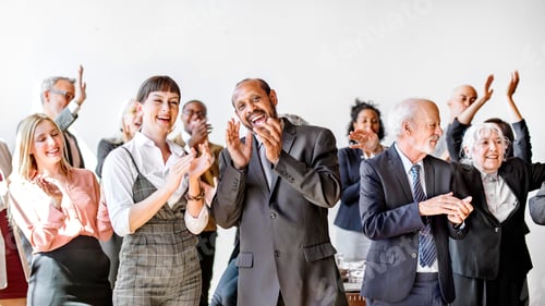 Preview: Team of diverse business people clapping