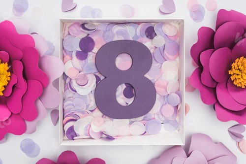 Preview: top view of paper flowers, confetti and number 8 in box isolated on white