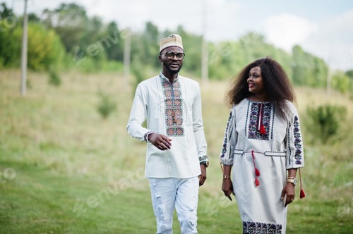 Preview: African couple in traditional clothes at park.