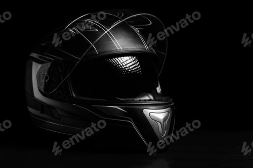 Preview: A black motorcycle helmet on dark background.