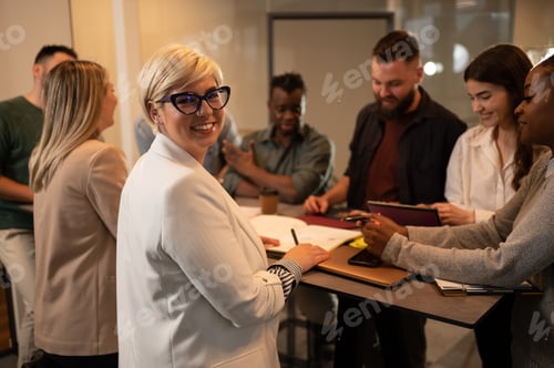 Preview: Multiracial business team working together and having a meeting in the office