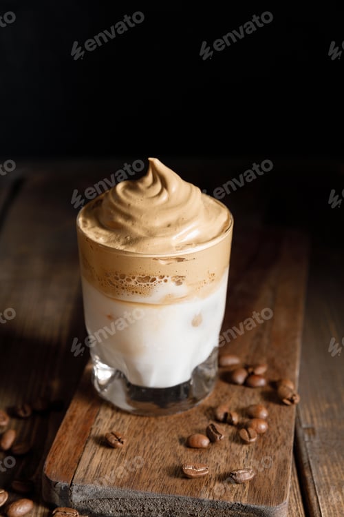 Preview: The Korean coffee drink dalgona on dark wooden background