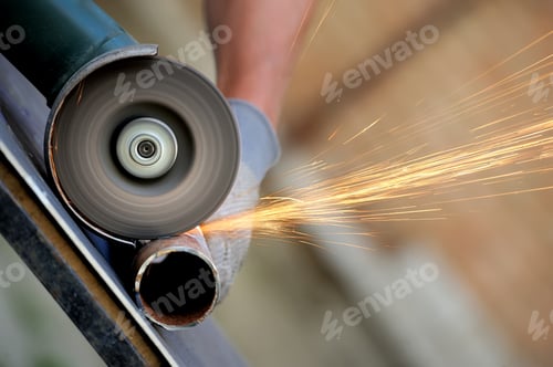 Preview: Worker cutting metal with grinder