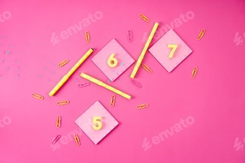 Preview: top view of different colorful appliances on pink