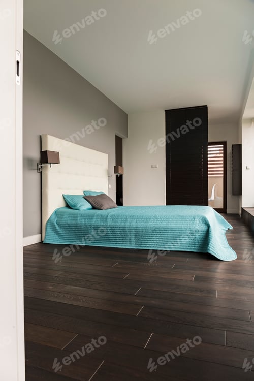 Stylish Bedroom Interior with Turquoise Bedding and Headboard