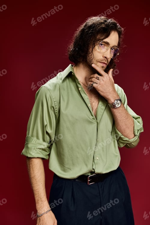 Preview: Stylish man in green shirt and black pants strikes a pose