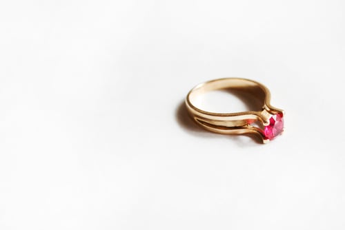 Preview: Golden ring with ruby stone on white background
