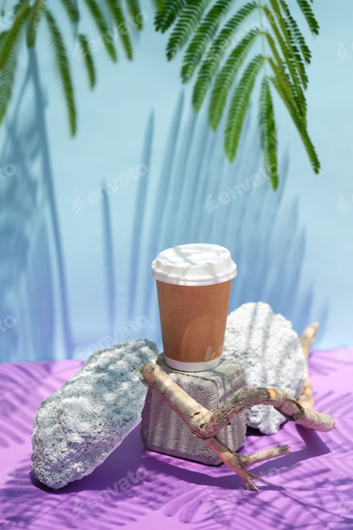 Preview: Take away cartoon coffee or tea cup on stone podium with green leaves shadows