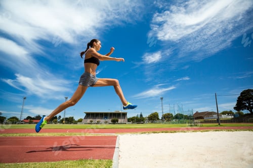 Preview: Female athlete performing a long jump