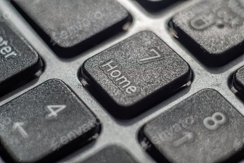 Preview: Closeup of a computer keyboard zoomed on the number 7 and Home button