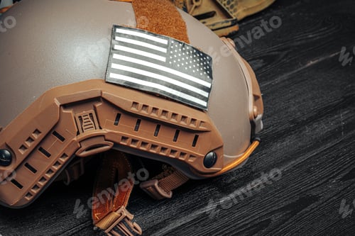 Preview: US military helmet on wooden background close up