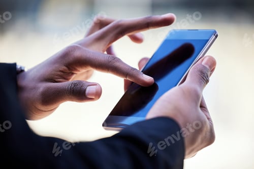 Preview: Lets get into the digital world. Shot of an unrecognizable businessman using a phone in the city.