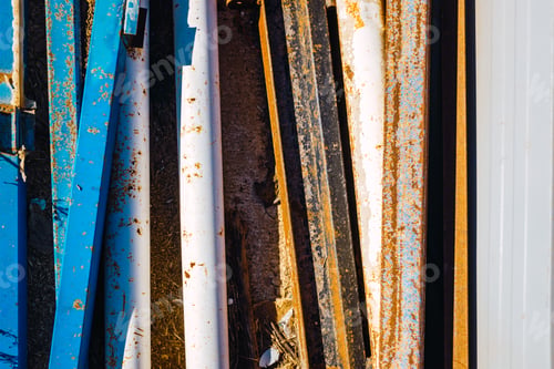 Preview: Remains of construction material old and rusty metal beams abandoned