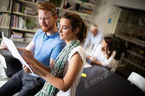Preview: Creative business people working on business project in office