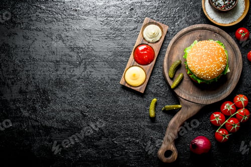 Preview: Burger with sauces,tomatoes and spices.
