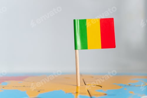 Preview: Closeup of a small Mali flag on a world map puzzle