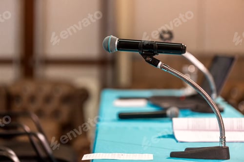 Preview: Microphone in concert hall or conference room soft and blur style for background.