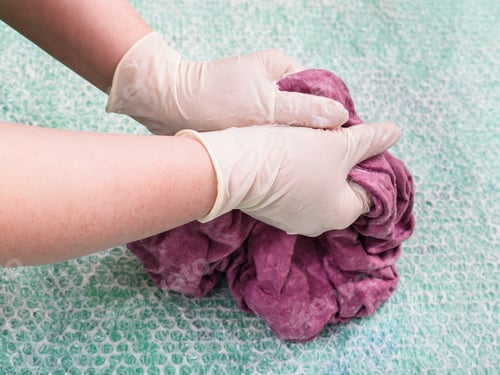 Preview: hatter tangles the wet felt hood from wool fibers