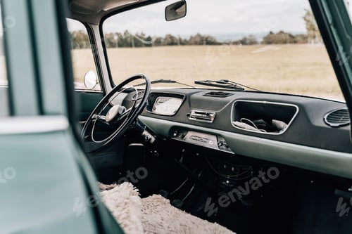 Preview: Stylish retro car in the field for a wedding ceremony
