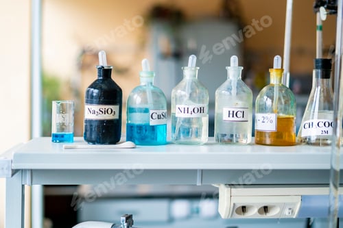Preview: chemical flasks with acid stand in laboratory b