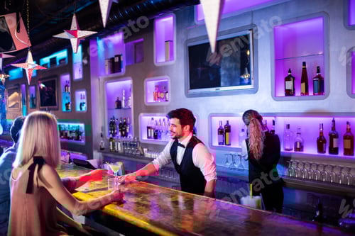 Preview: Waiter serving cocktail