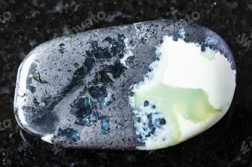 Preview: sample of polished khantigirite mineral on black