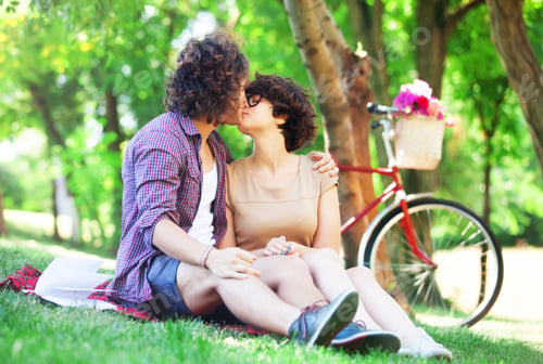 Preview: Couple with retro bike in the park