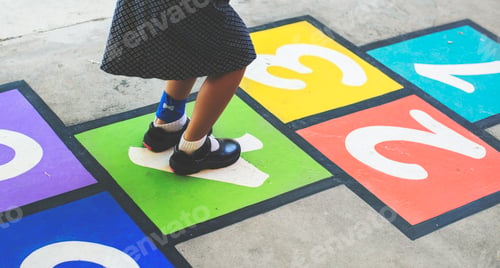 Preview: Young girl playing hopscotch