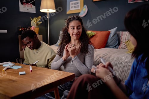 Preview: Smiling Woman Conversing with Friends in Cozy Living Room